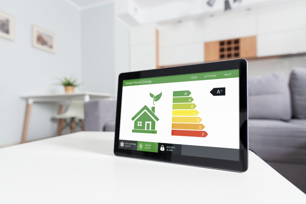 Tablet showing the energy efficiency of a home to talk about the importance of keeping energy efficiency in mind when planning a fireplace renovation.